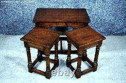 A Titchmarsh And Goodwin Style Oak Nest Of Three Coffee Tables Wine Lamp Stands