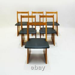 A set of six contemporary Church pew style solid oak dining chairs