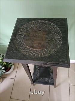 Arts and Crafts tall two tier Hand Carved ebonised/ dark oak plant stand