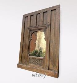 Large Antique Rustic Eastern Style Architectural Panelling With Later Mirror