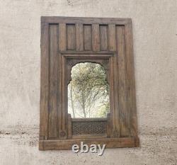 Large Antique Rustic Eastern Style Architectural Panelling With Later Mirror
