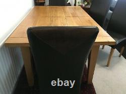 Solid oak Dining Table plus 6 leather chairs