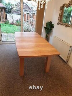 Solid oak extendable dining table and chairs