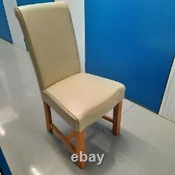 URGENT! Oak dining room suite with 6 scroll back Off White leather chairs