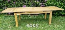 Used solid oak extending dining table