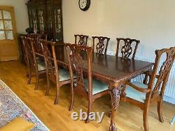 Used solid oak extending dining table and chairs