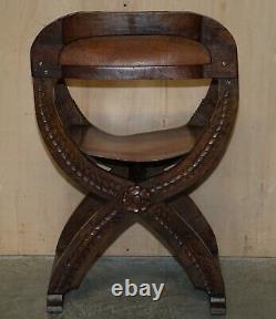 Vintage English Oak Jacobean Style Hand Carved Brown Leather X Framed Armchair
