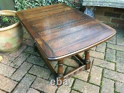 Vintage solid oak twist top drop leaf table on ring turned supports