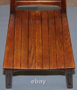 Ensemble de quatre chaises de salle à manger en chêne rouge moderne du milieu du siècle, élégantes et sculpturales.