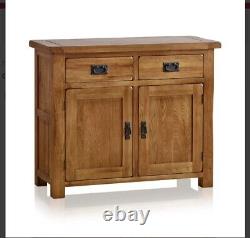 Meuble de rangement en chêne massif Oak Furniture Land, petit buffet avec 2 portes et 2 tiroirs, en bois massif d'occasion.