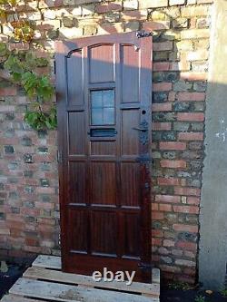 Porte d'entrée en bois de chêne massif marron d'origine des années 1930 très solide et lourde